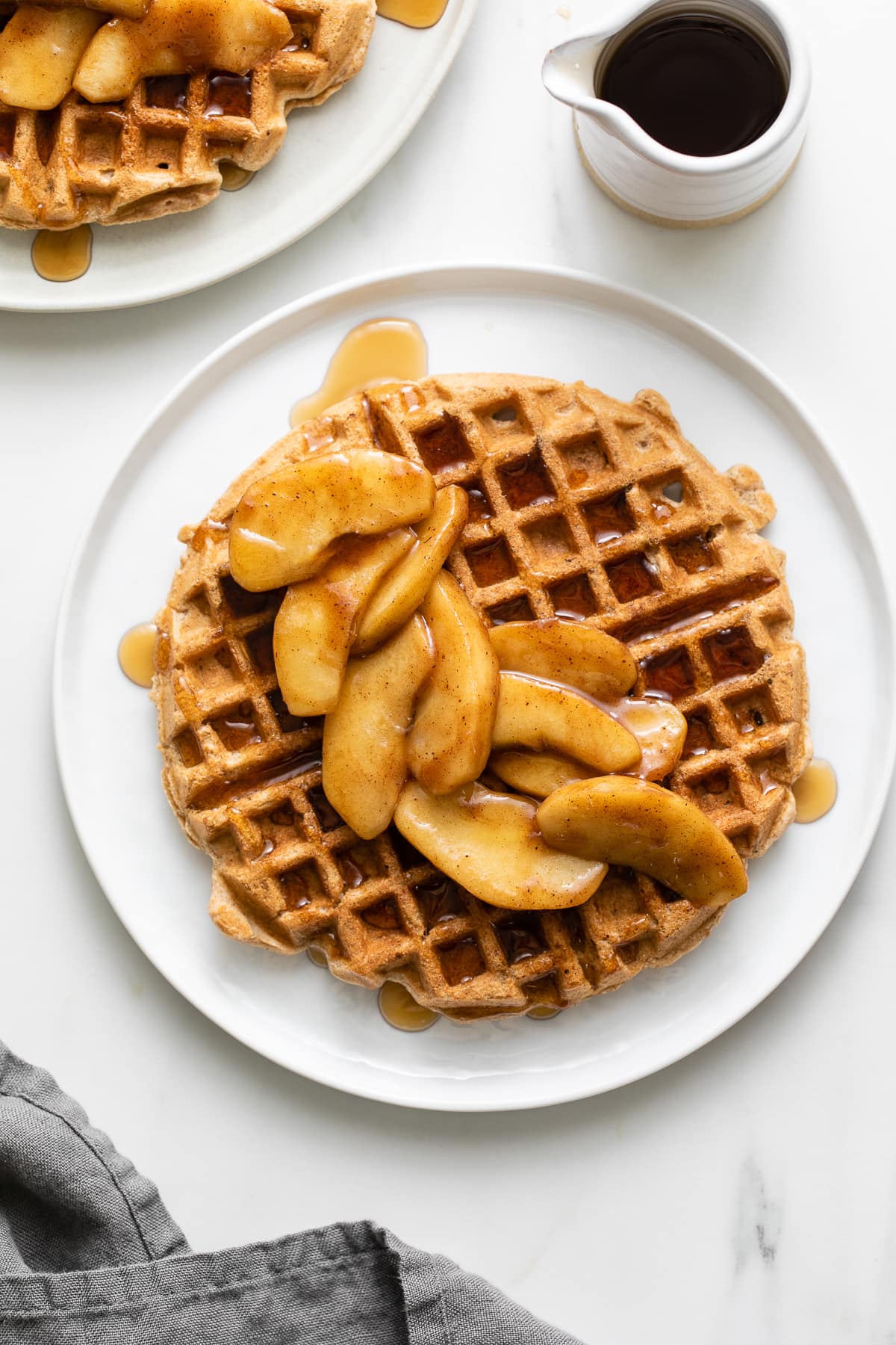 top down view of plated cinnamon applesauce waffles.