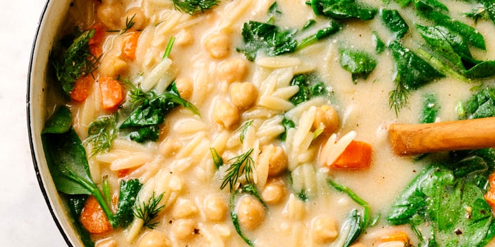 lemon chickpea orzo soup freshly cooked in a pot and ready to serve