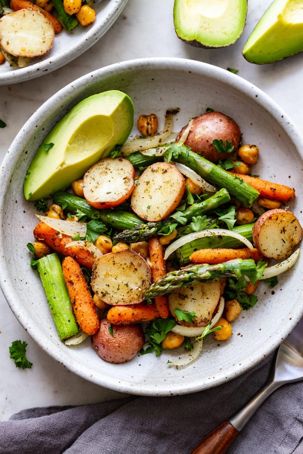 bowl with roasted asparagus, potato + chickpea with avocado
