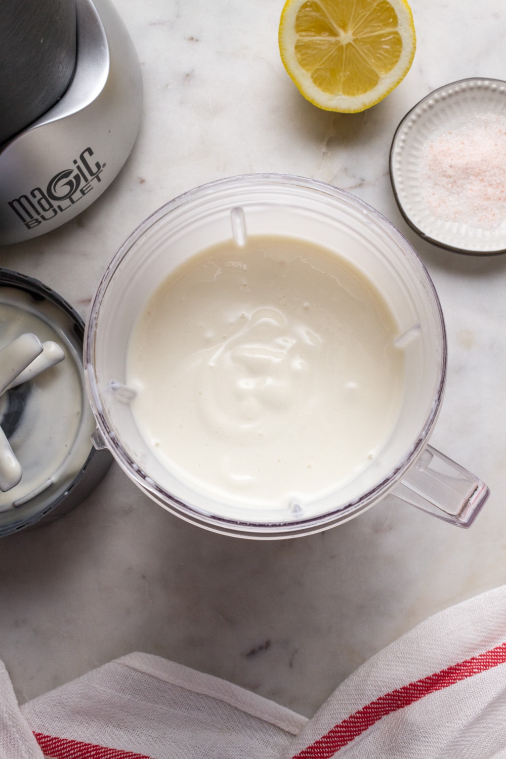 creamy vegan mayonnaise in the cup of a nutribullet, just blended