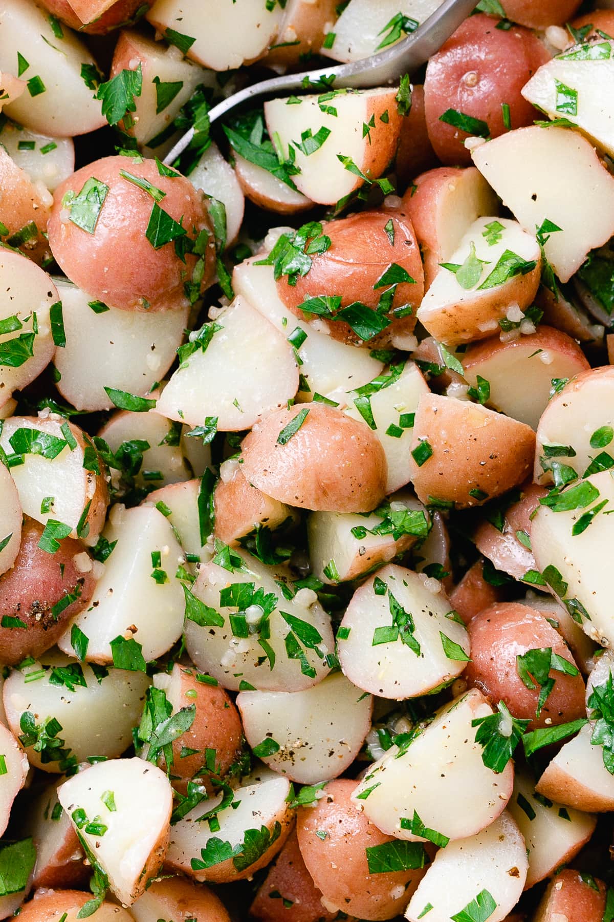 up close top down view of vegan herbed potato salad.