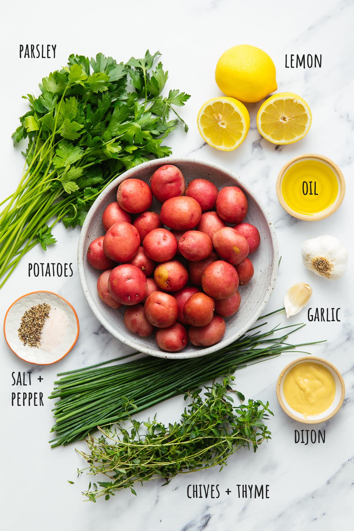 top down view ingredients used to make herbed potato salad recipe.