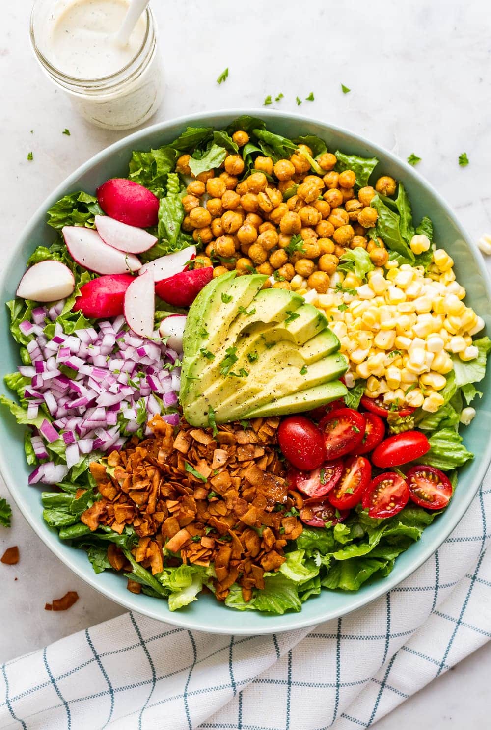 top down view of vegan california cobb salad before adding vegan ranch dressing.