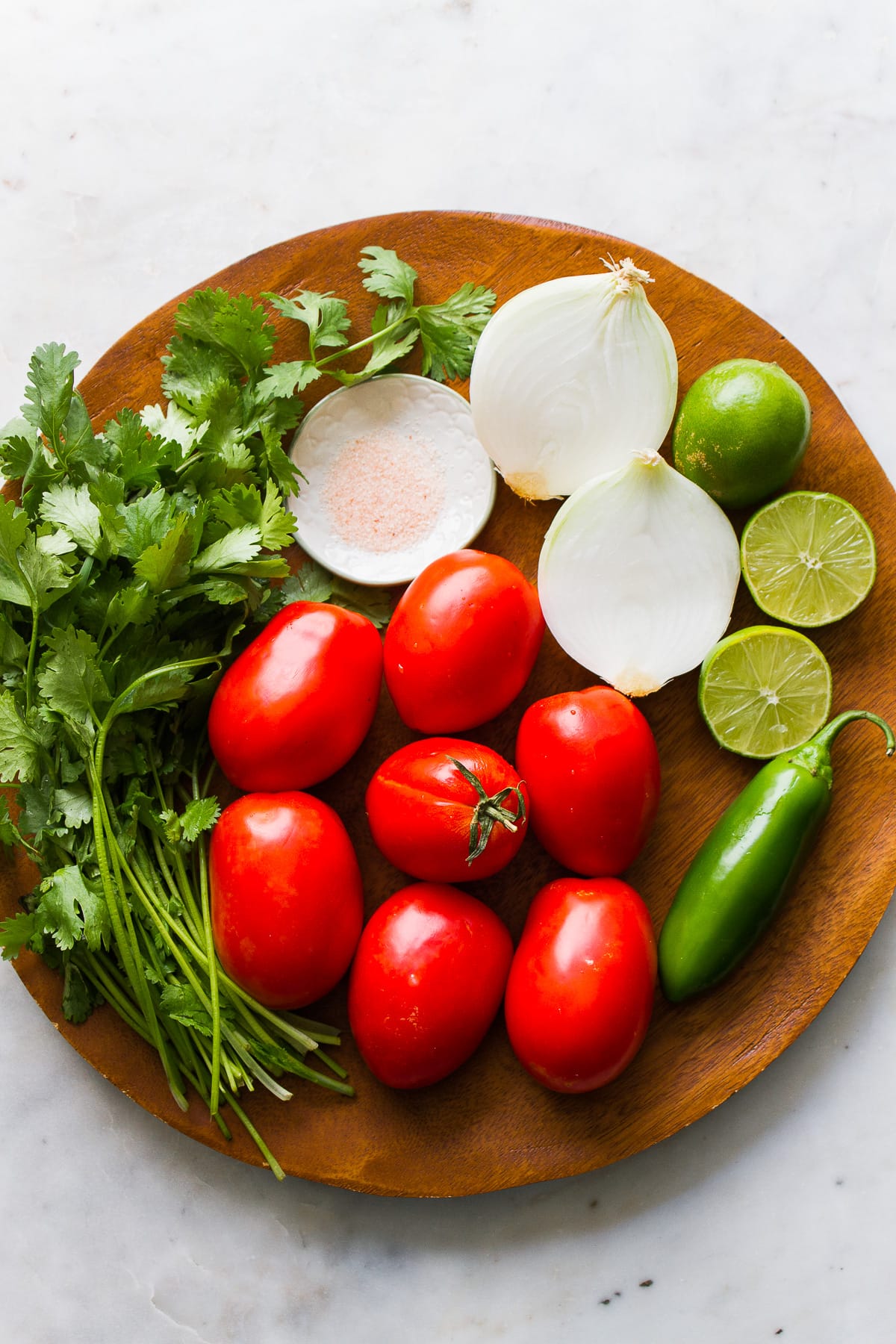 top down view of ingredients needed to make fresh pico de gallo.