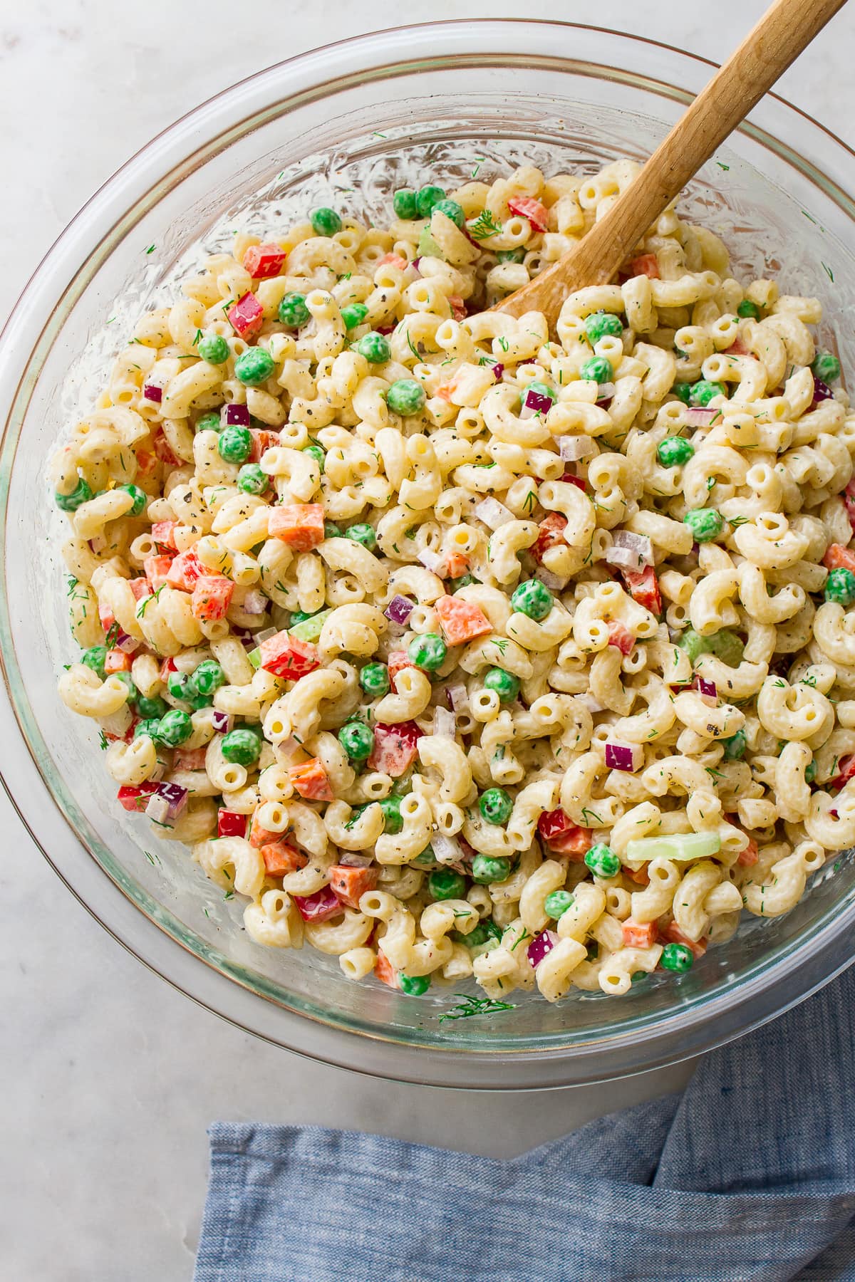 top down view of easy vegan macaroni salad in a glass bowl.