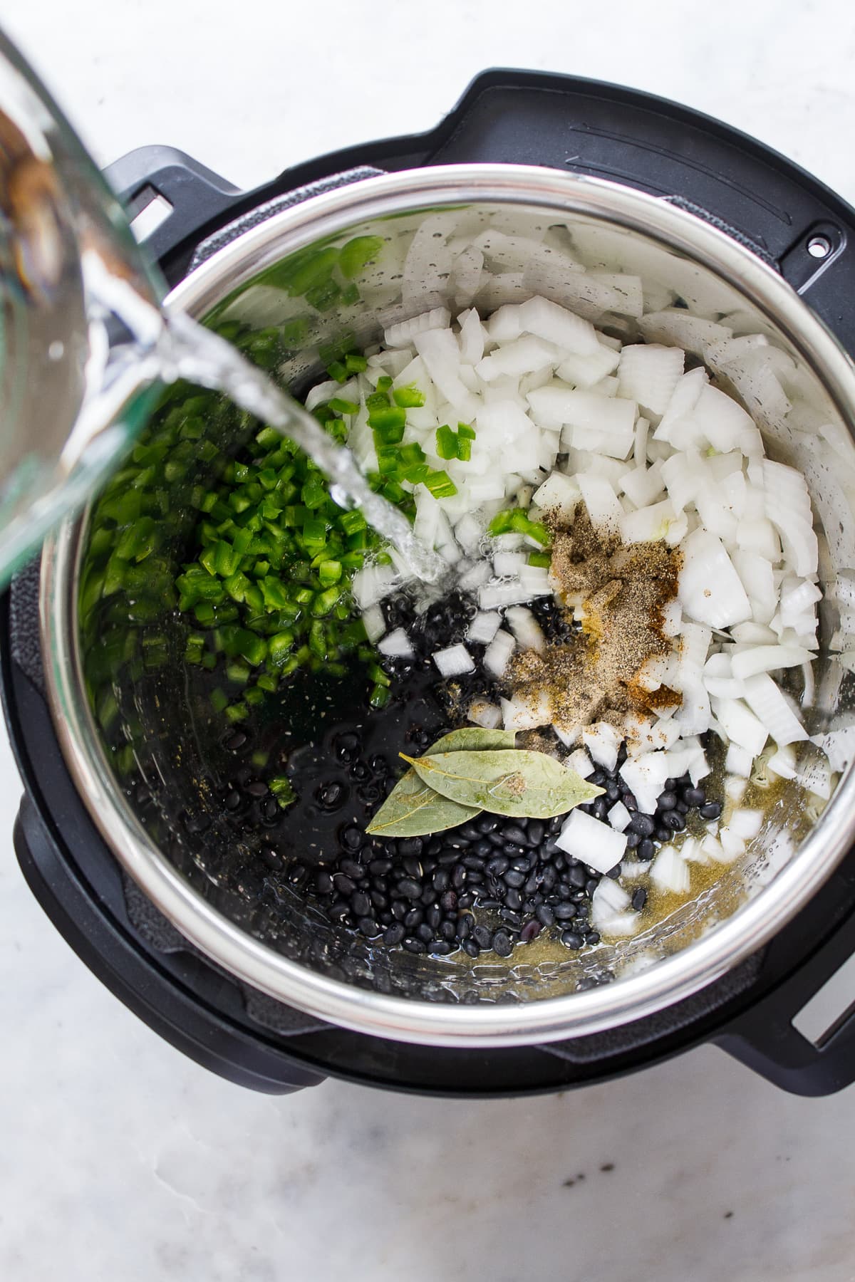 top down view of the process of making easy instant pot black beans.
