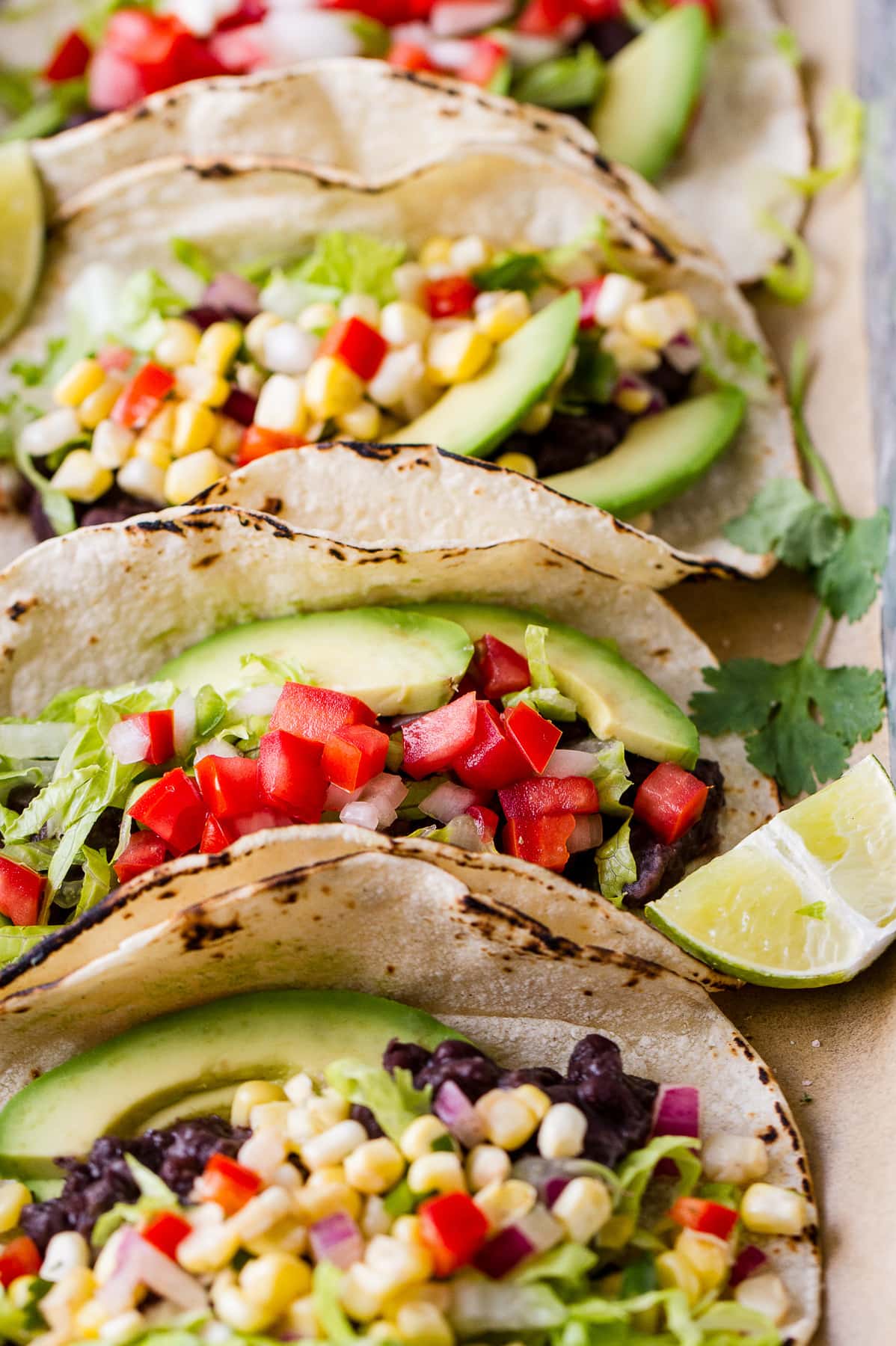 side angle view of easy black bean tacos on a serving tray.