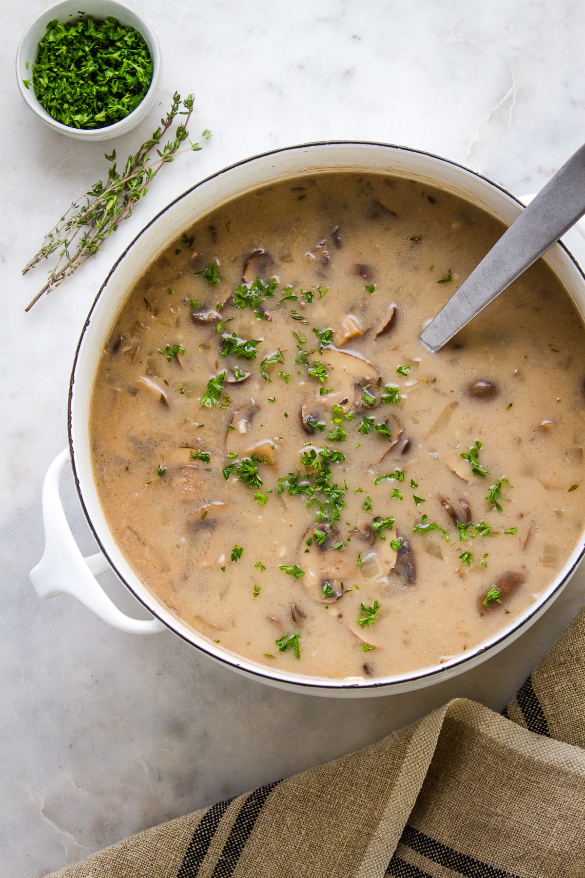 top down view of freshly made pot of vegan mushroom soup.