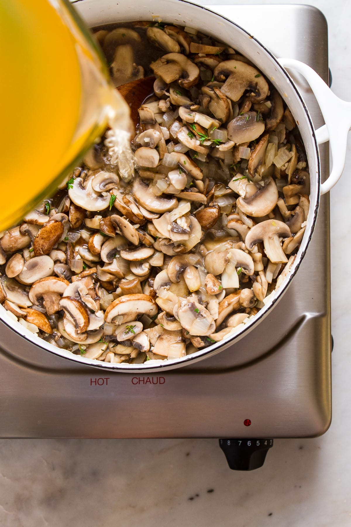 top down view of the process of making vegan mushroom soup.