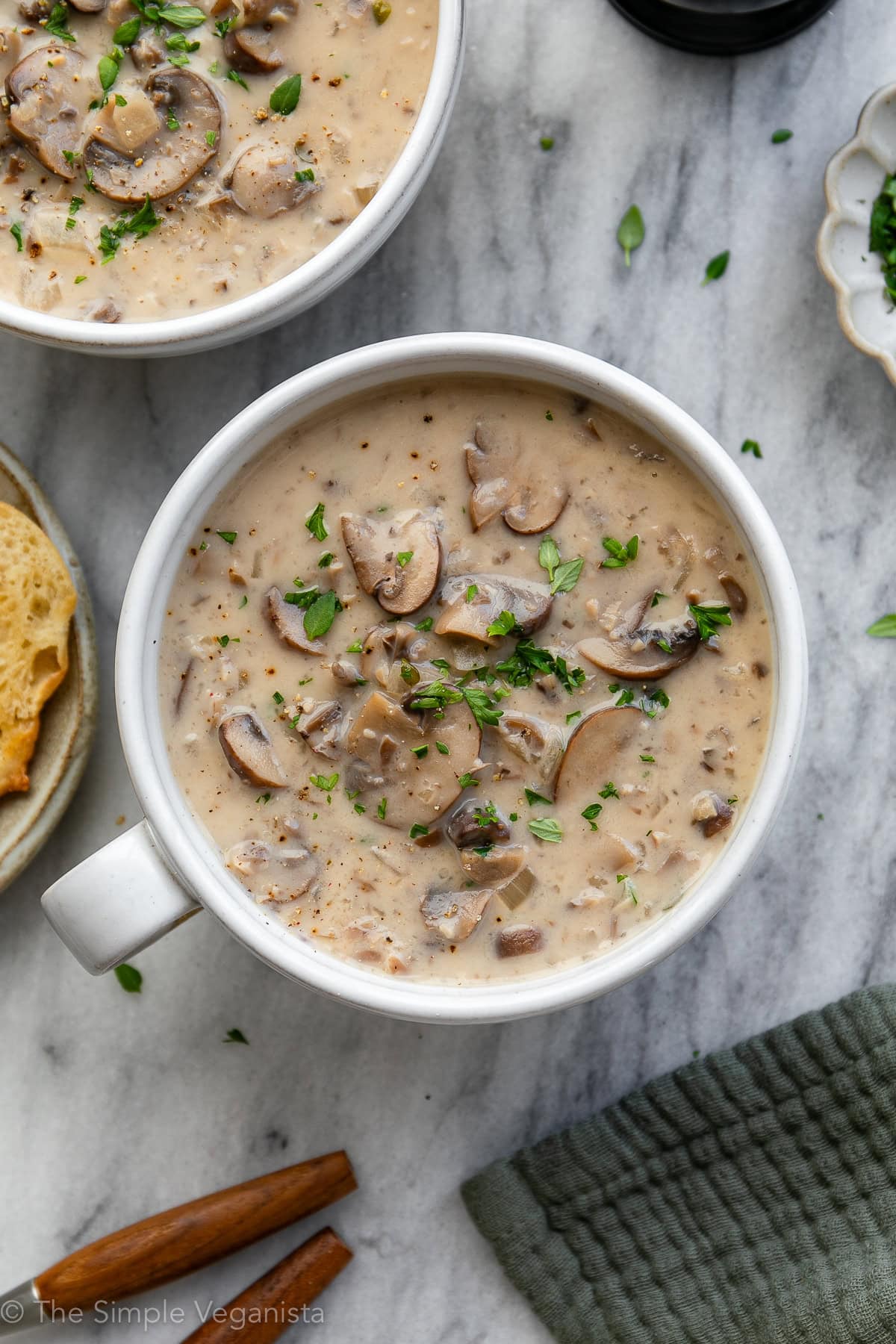 Creamy vegan mushroom soup in a bowl with thyme.