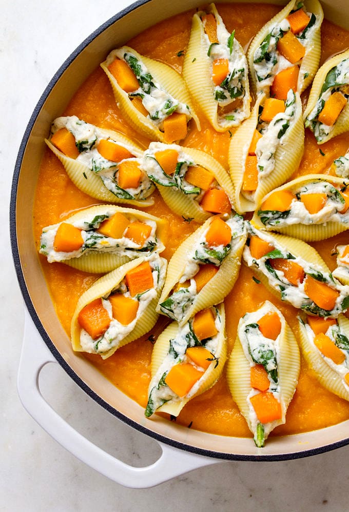 top down view of a casserole with freshly made butternut squash stuffed shells.