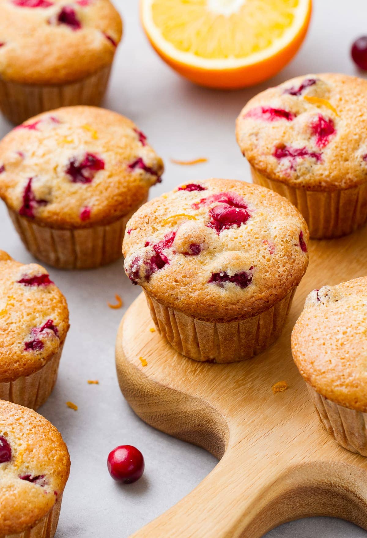 side angle view of freshly made oil free cranberry orange muffins.