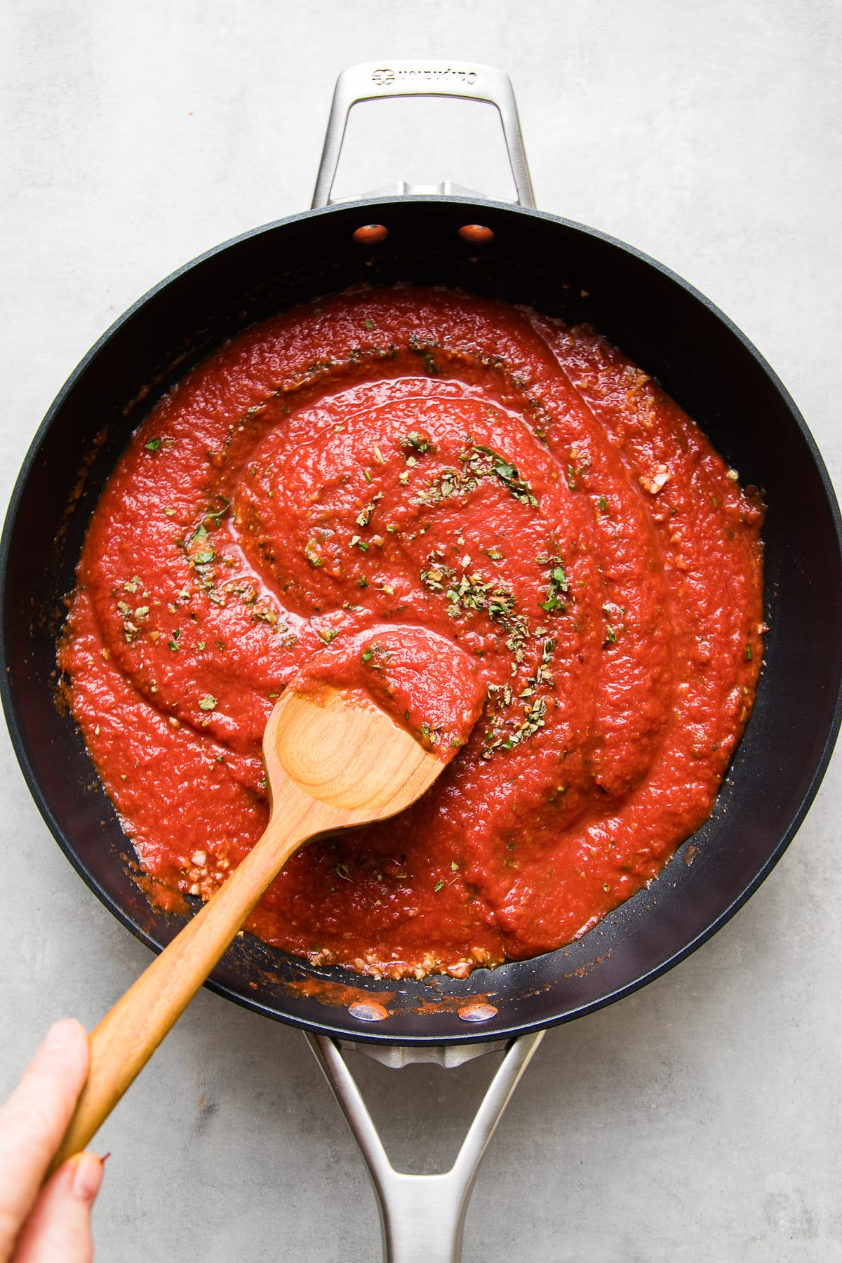 top down view of showing the process of making homemade marinara sauce recipe.
