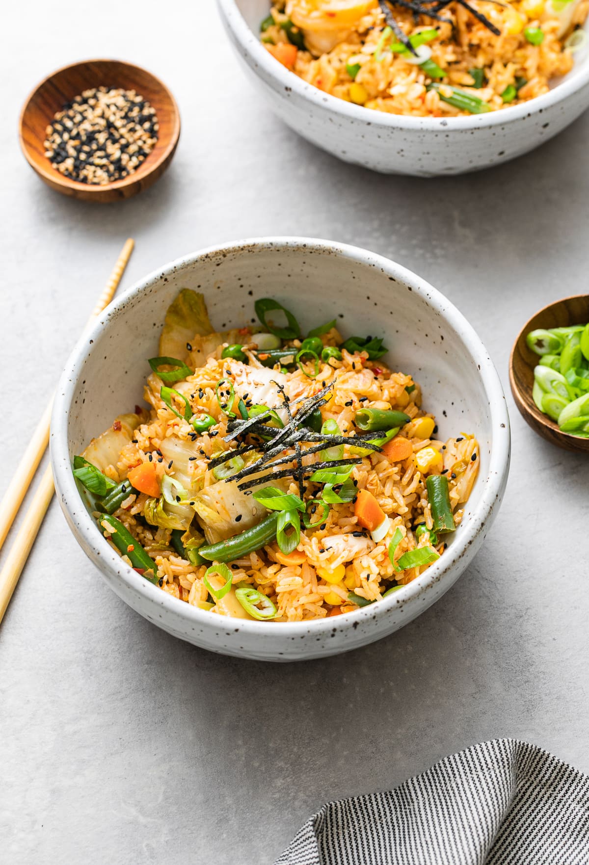 side angle view of bowl with serving of kimchi fried rice.