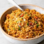 side angle view of healthy quinoa Spanish rice in a serving bowl.