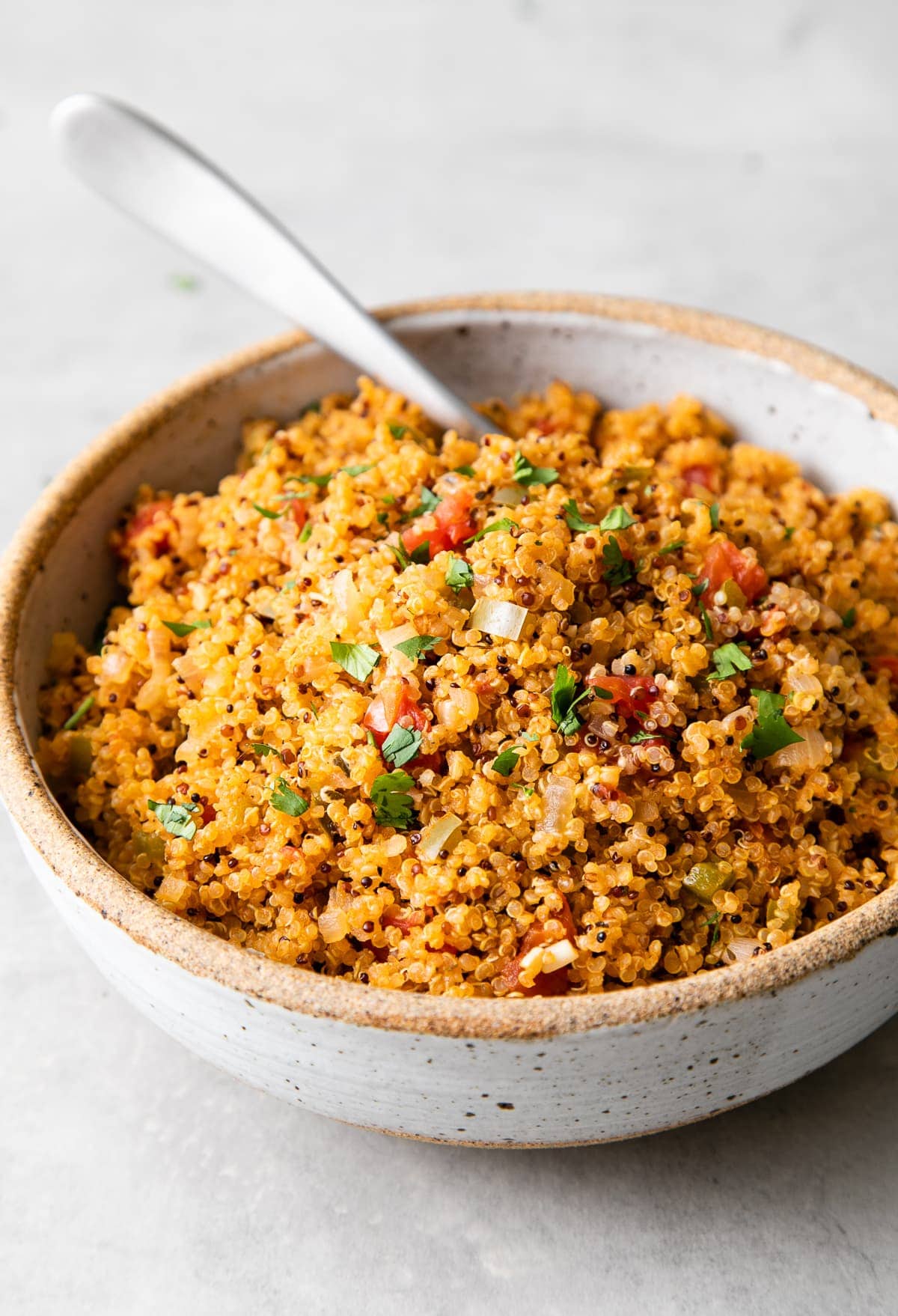 side angle view of healthy quinoa Spanish rice in a serving bowl.
