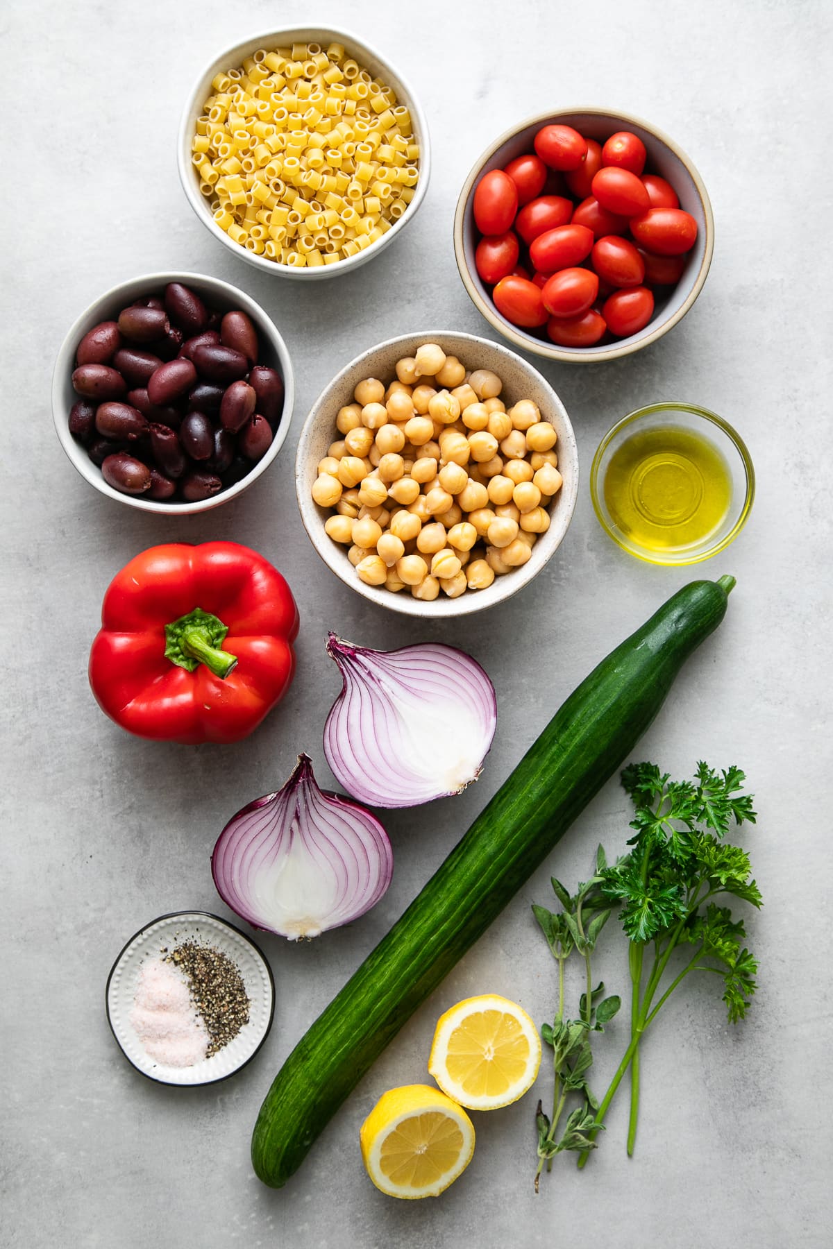 top down view of ingredients used to make vegan Greek pasta salad recipe.