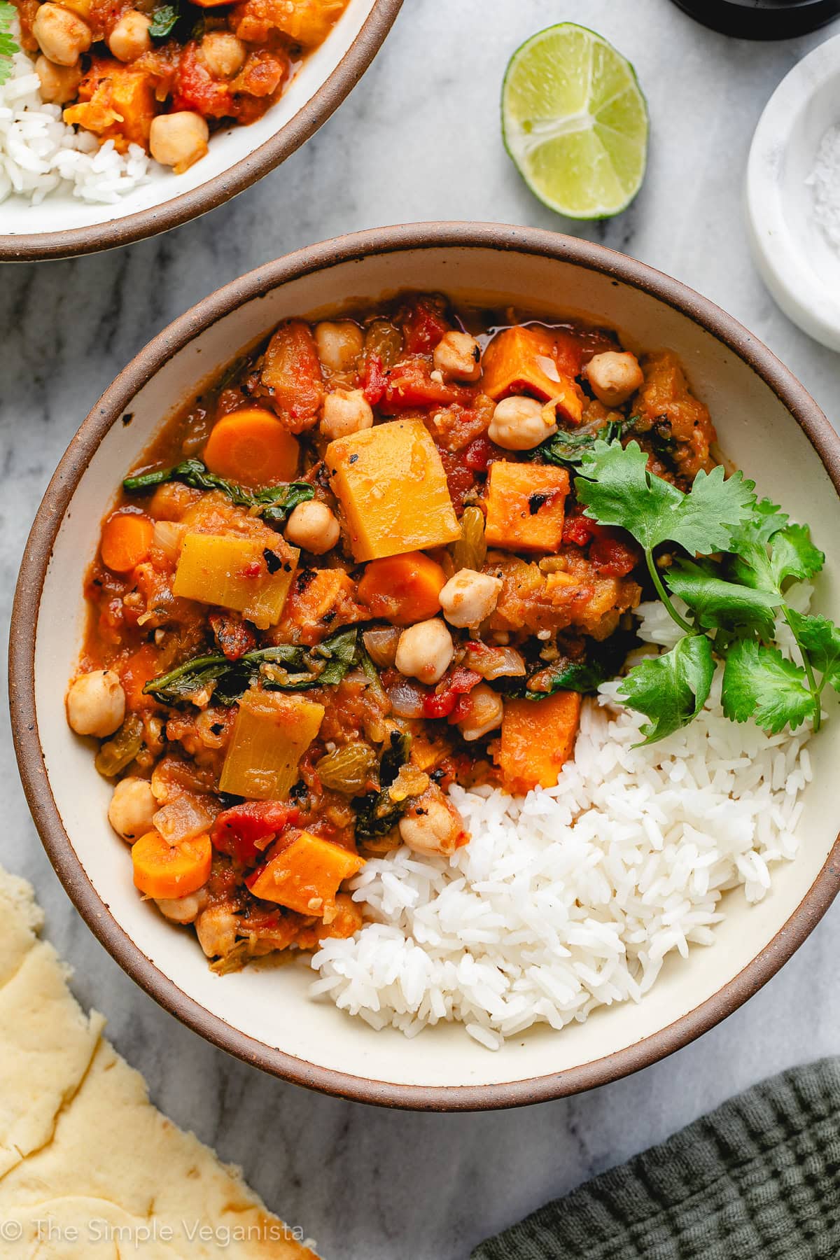Moroccan pumpkin chickpea stew in a bowl with warm spices.