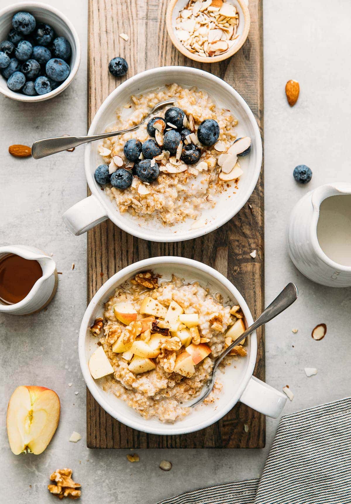 top down view of 2 healthy bowls of Instant Pot steel cut oats in a bowl with flavor topping.