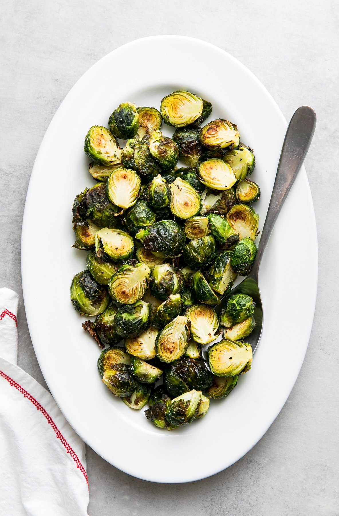 top down view of serving platter with roasted brussels sprouts.