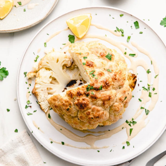 Whole Roasted Cauliflower w/ Tahini Sauce - The Simple Veganista