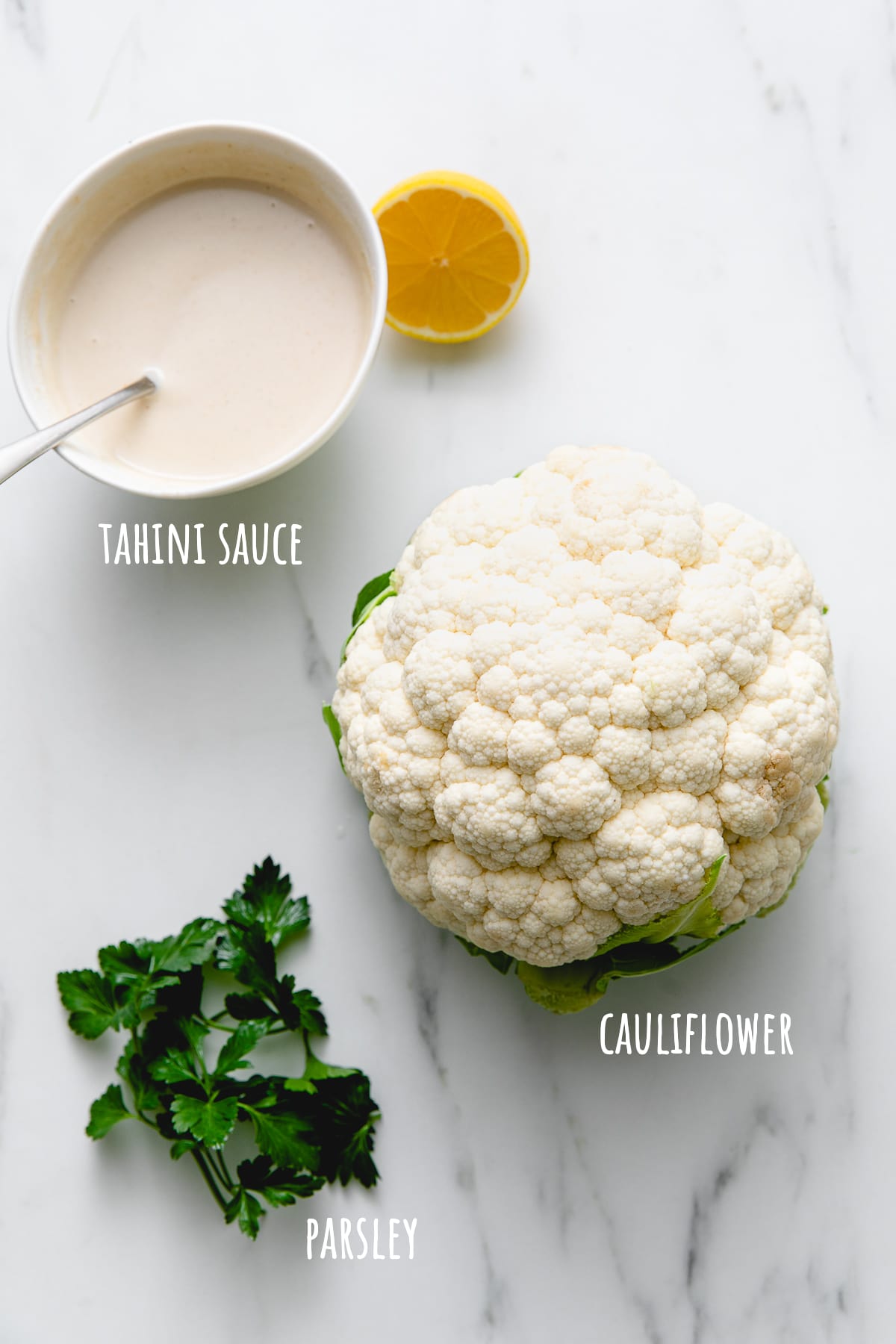top down view of ingredients used to make whole roasted cauliflower.
