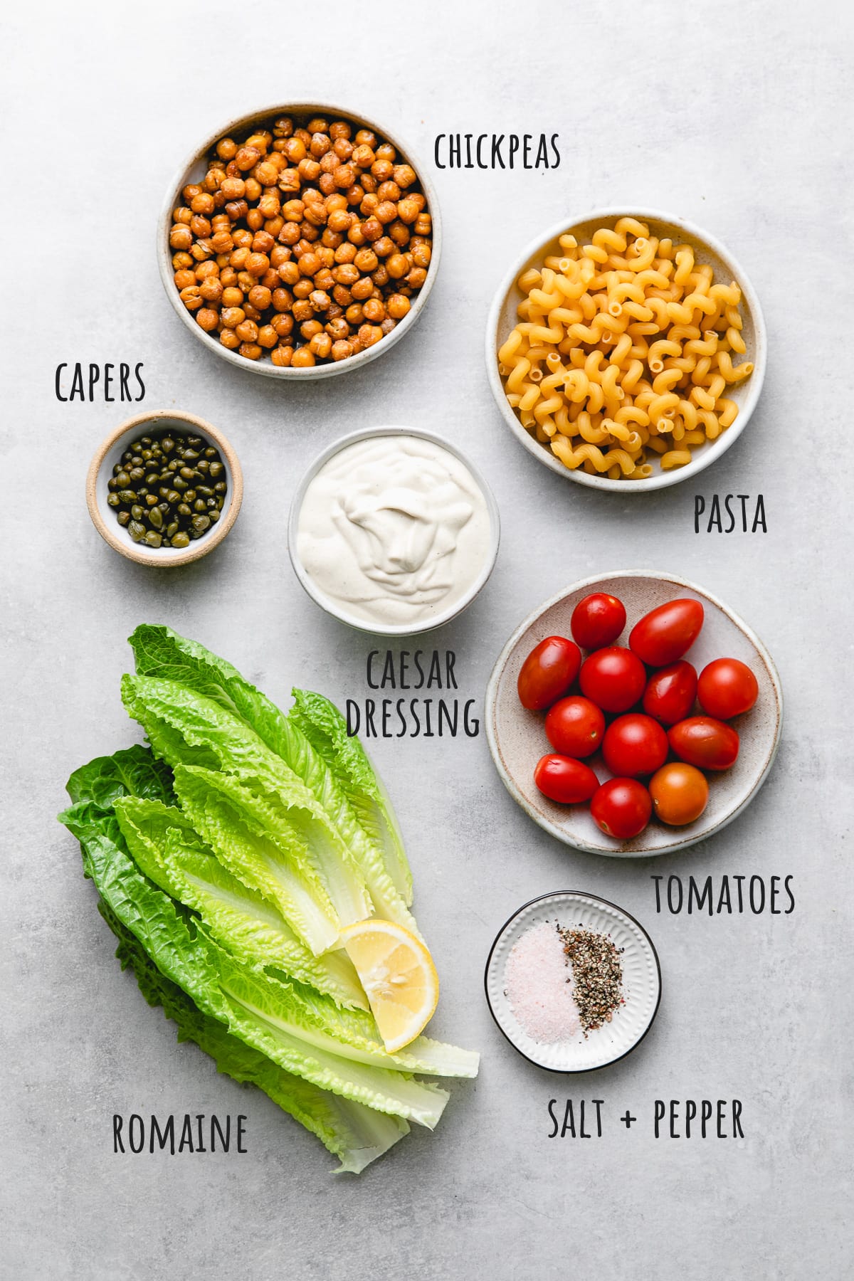 top down view of ingredients used to make caesar pasta salad.