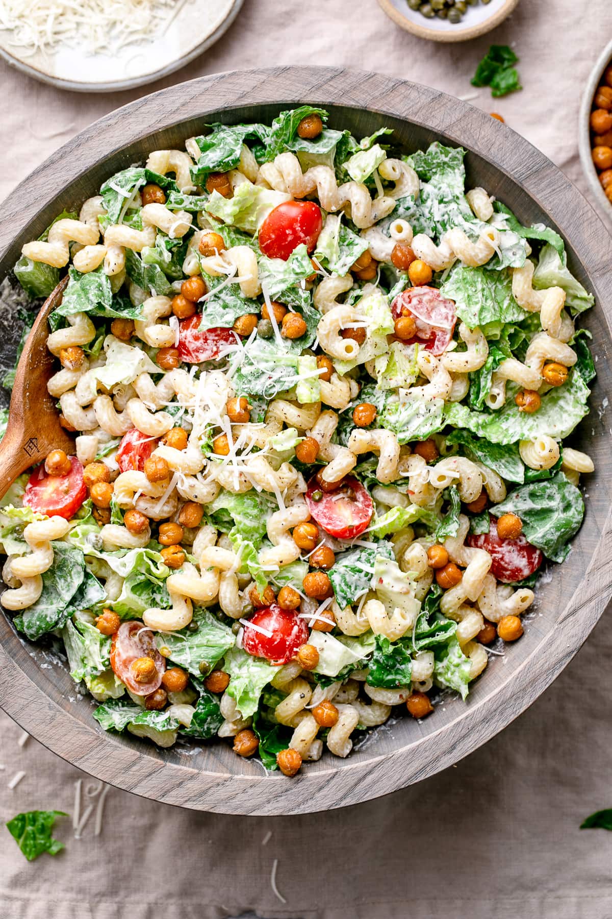 top down view of serving bowl with healthy vegan caesar pasta salad.