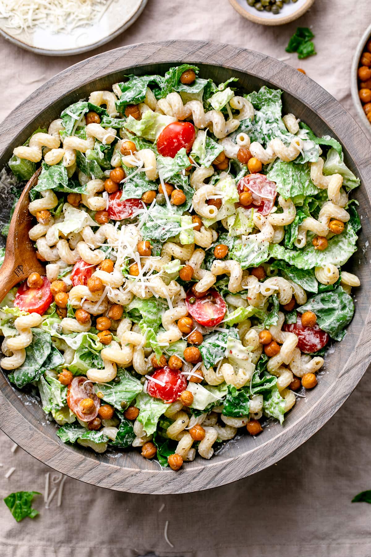 top down view of serving bowl with healthy vegan caesar pasta salad.