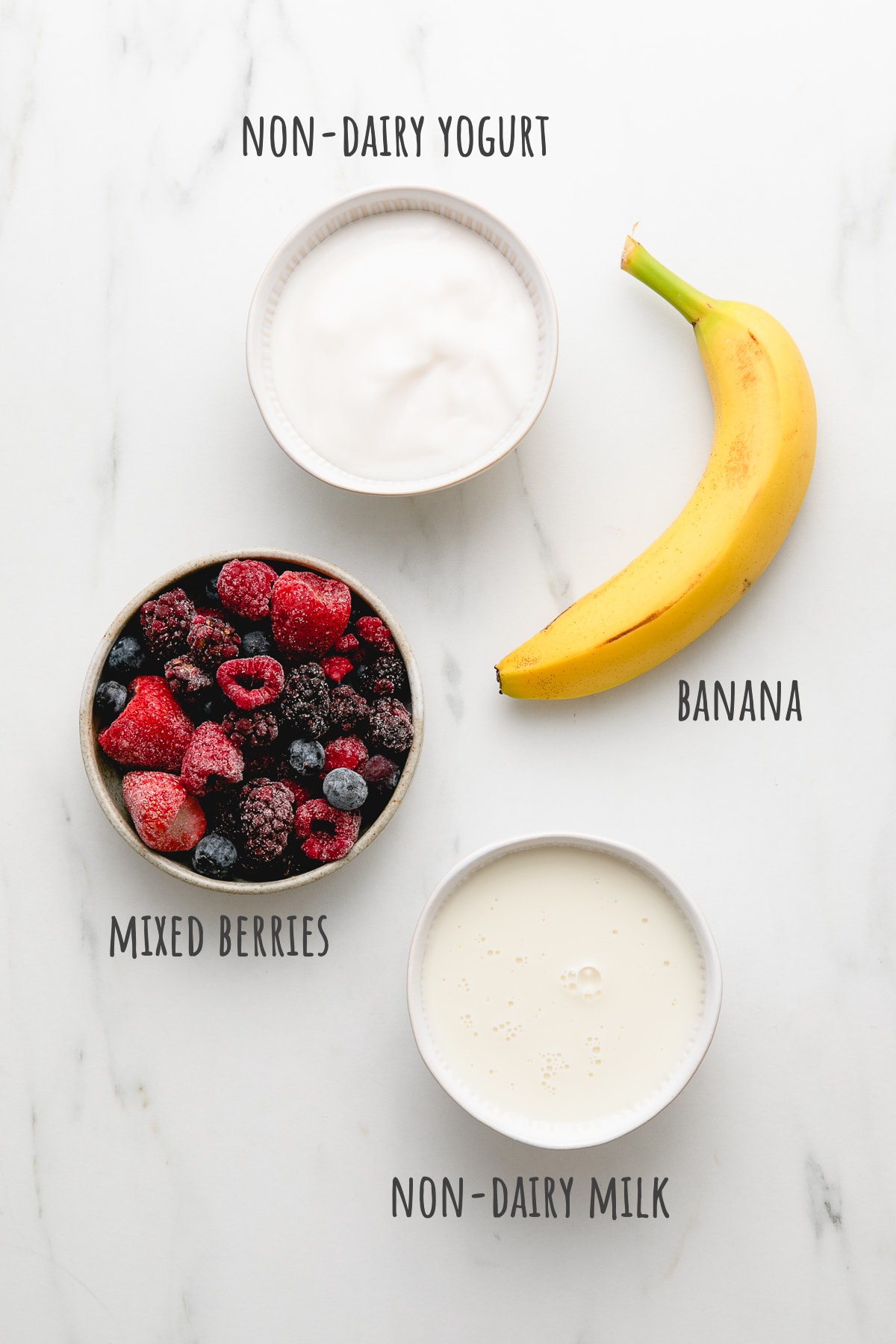 top down view of ingredients used to make mixed berry yogurt smoothie recipe.