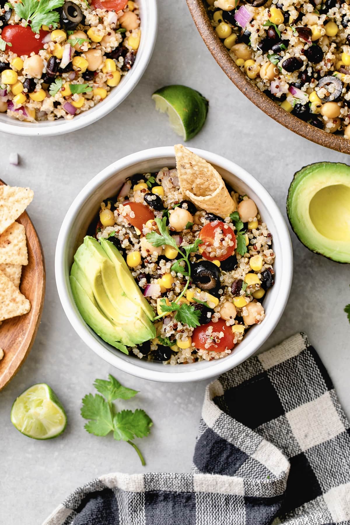 top down view of southwest quinoa salad in a bowl with items surrounding.