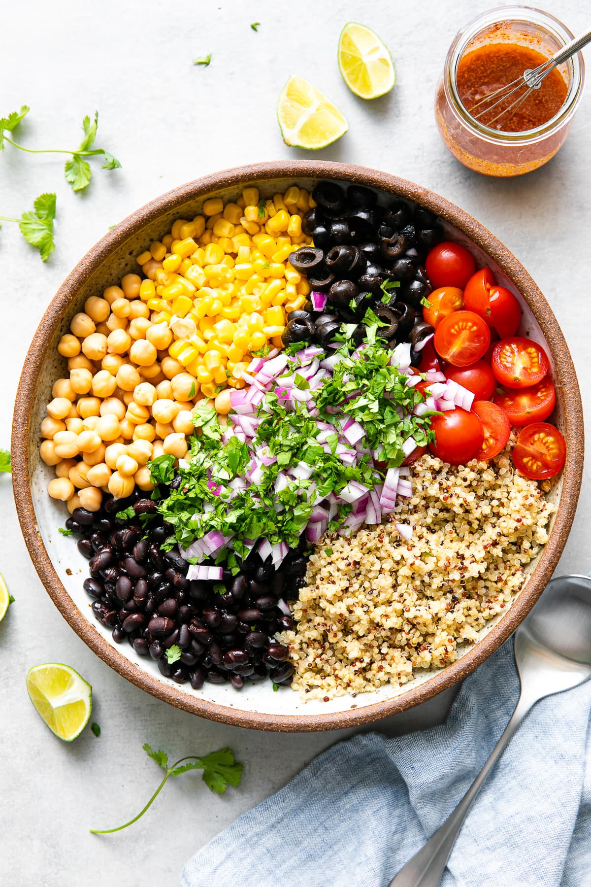 top down view of bowl filled with ingredients used to make southwest quinoa salad.