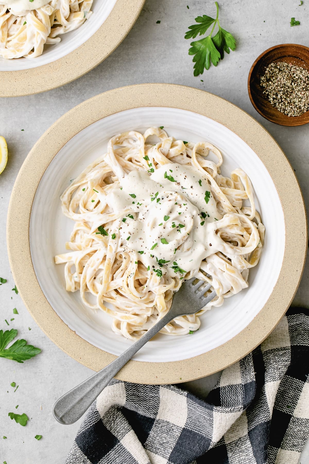 top down view of plated vegan alfredo sauce with pasta.
