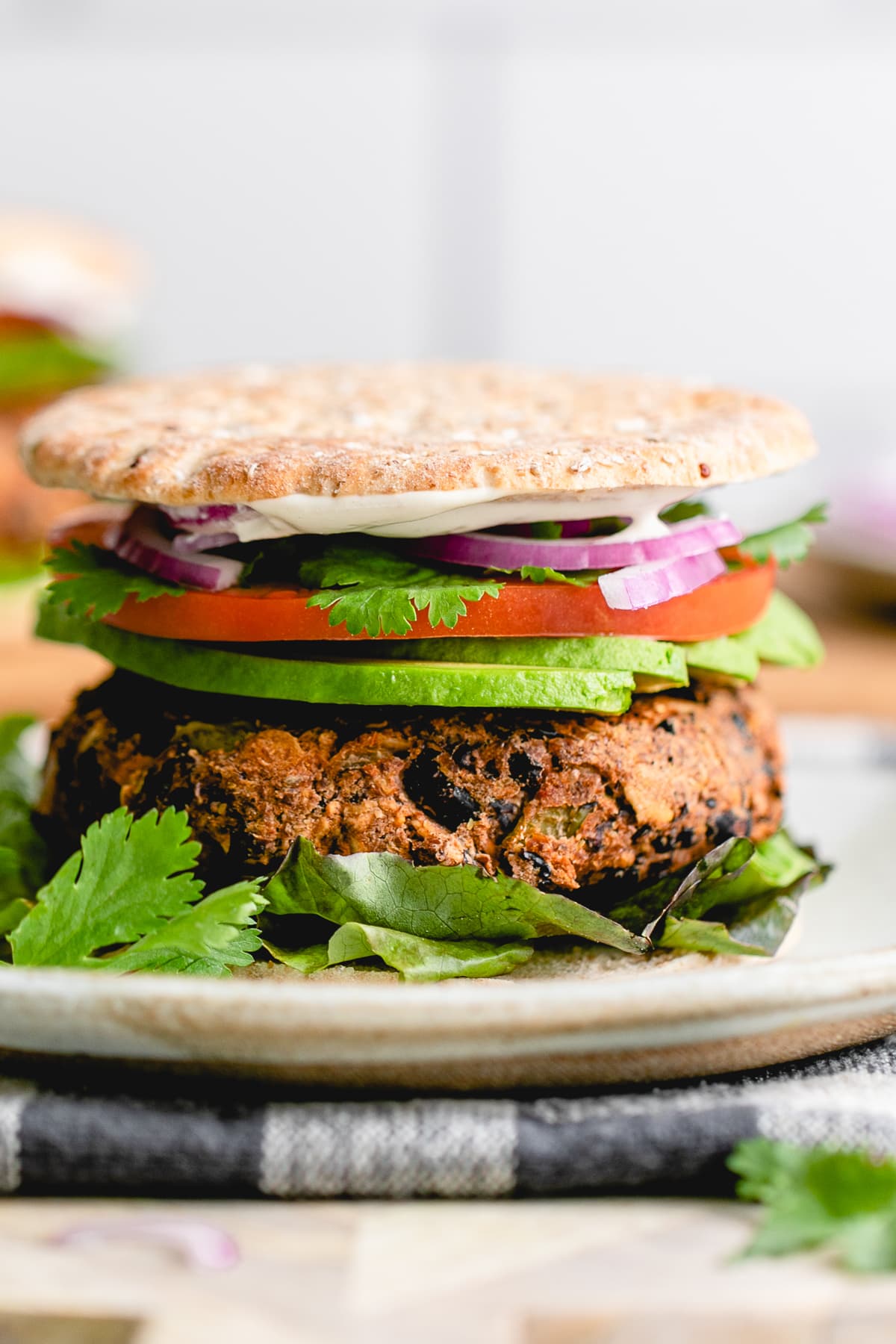 head on view of Sante fe black bean burger on a plate.