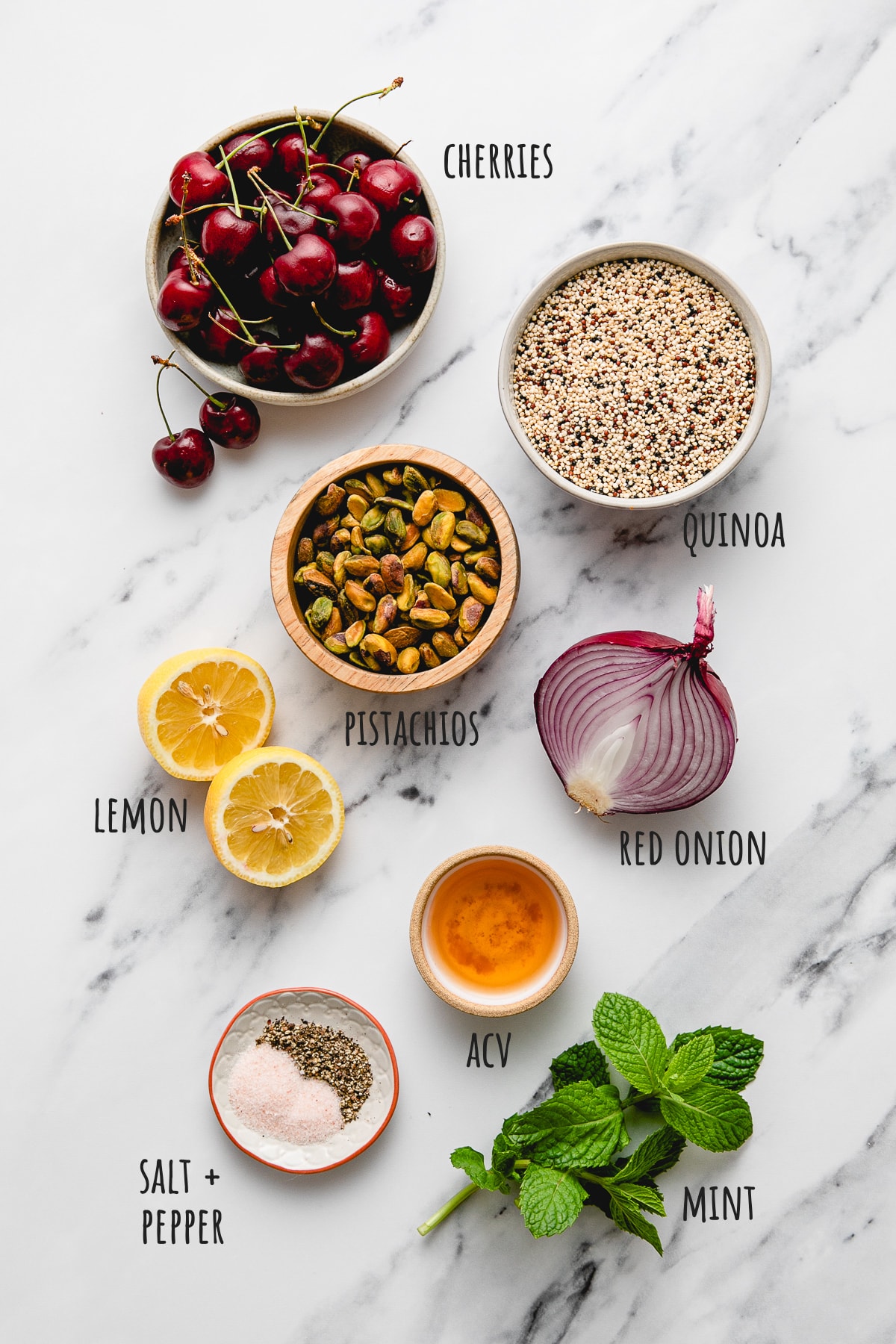 top down view of ingredients used to make cherry pistachio quinoa salad recipe.