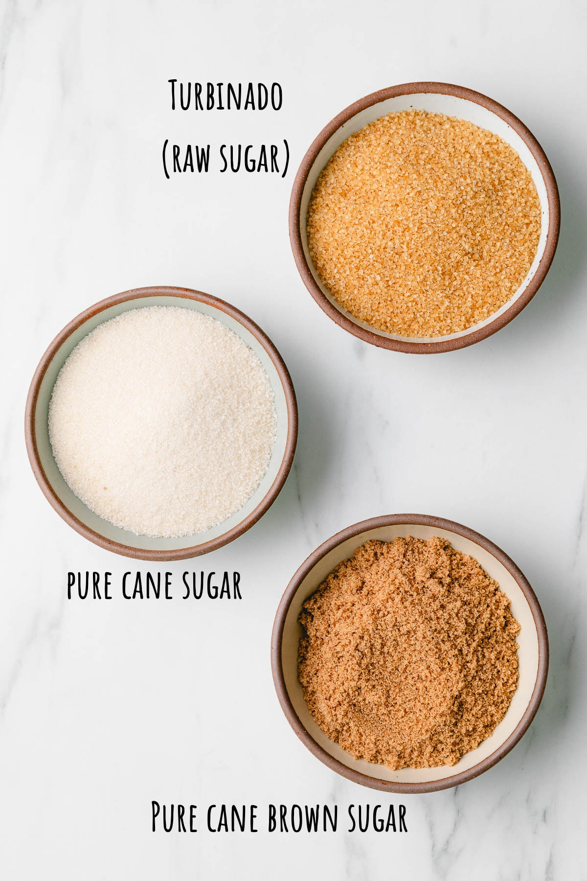 top down view of 3 different sugars in bowls.