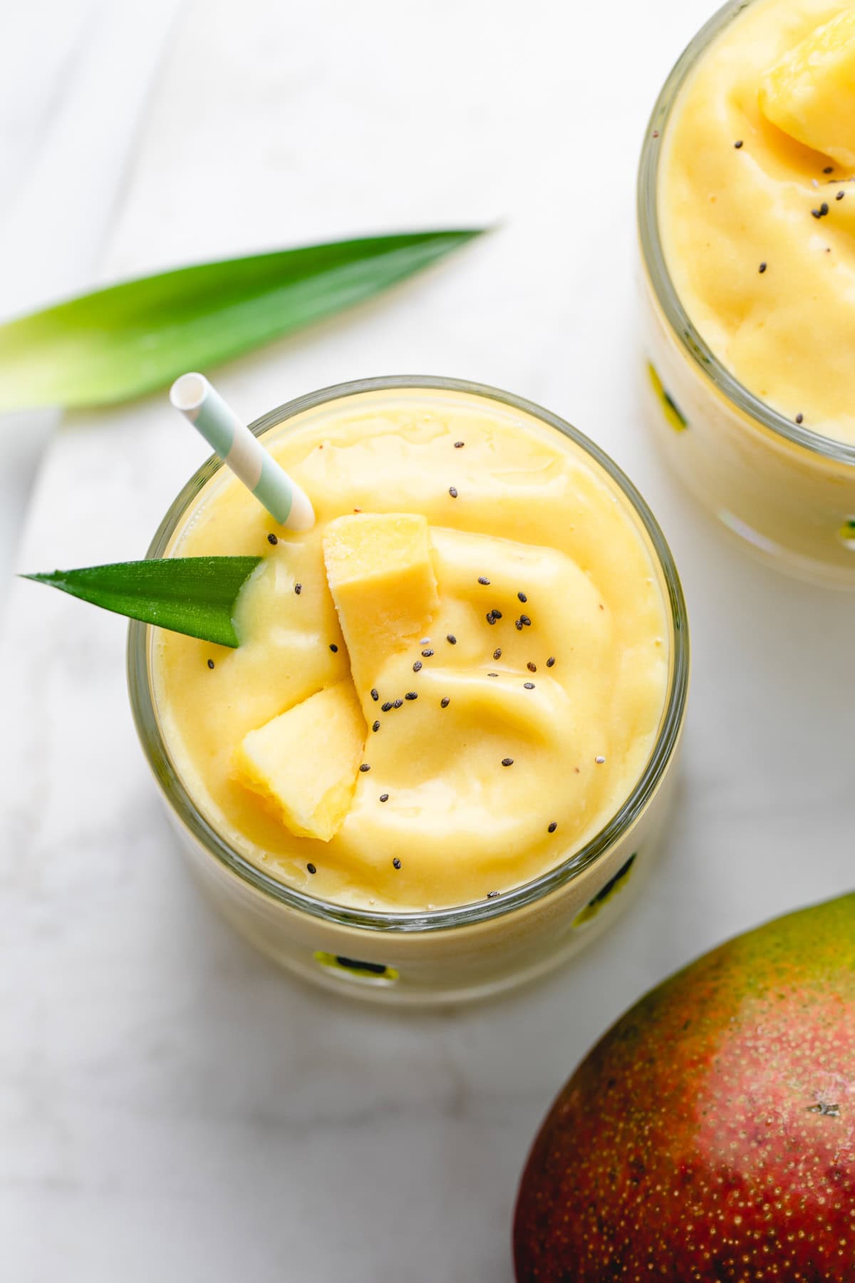 vibrant vegan pineapple mango banana smoothie.