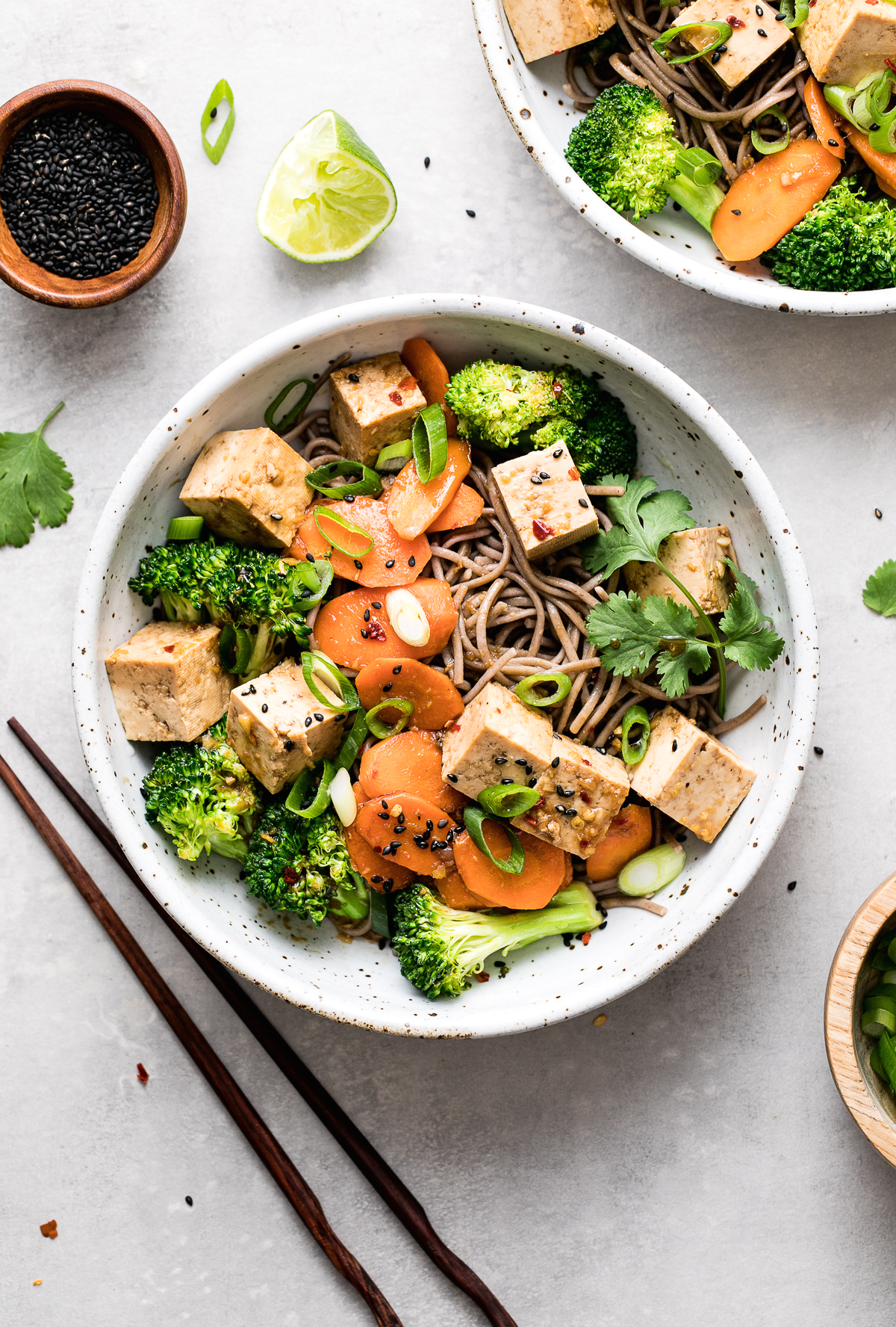 vegan soba bowl tofu, carrots, broccoli, and scallions and fresh lime.