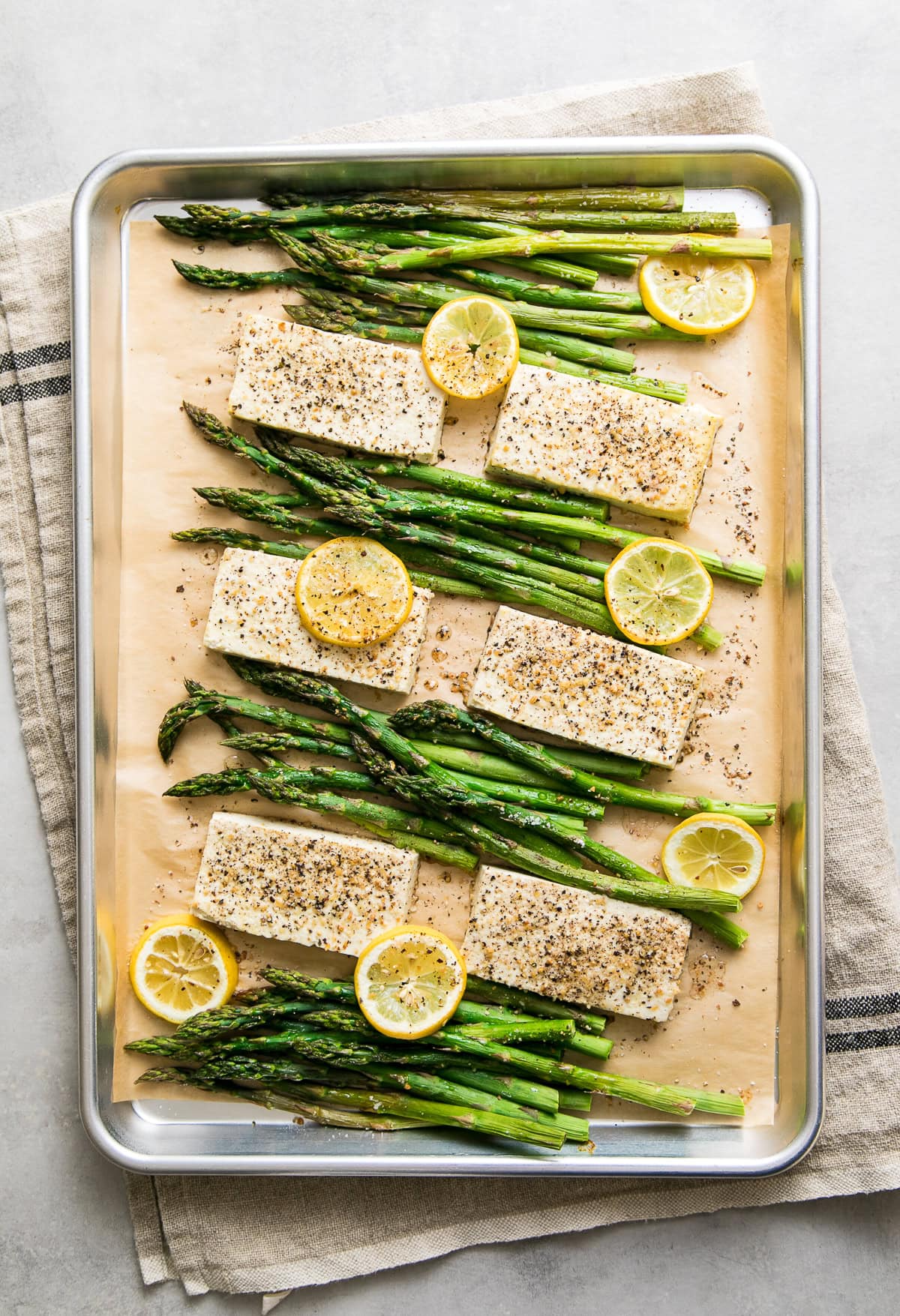 vegan sheet pan meal with lemon pepper tofu and asparagus.