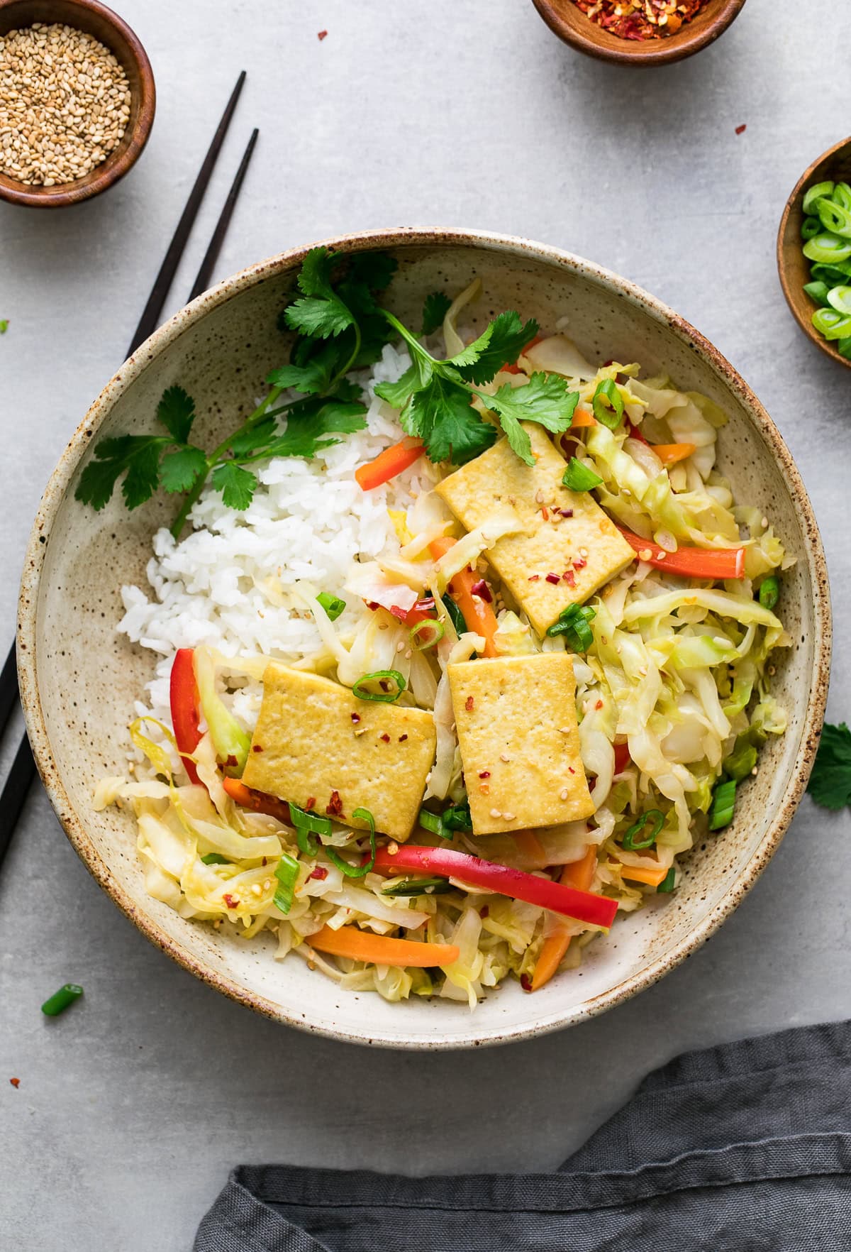 quick vegan stir-fry with tofu and colorful vegetables.